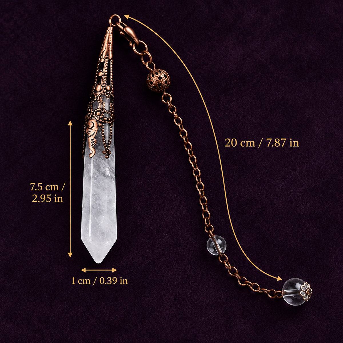Handcrafted crystal pendulum arranged on an altar space with candles and tarot cards for ritual practice.
