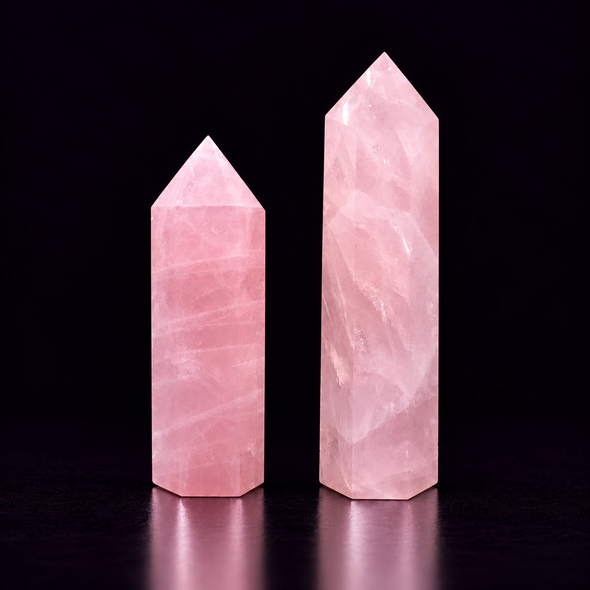 Rose Quartz crystal wand catching daylight to promote compassionate self-love and calm.